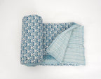 Detail of artisan block print on organic cotton quilt | Myyra Jaipur