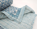 Detail of artisan block print on organic cotton quilt | Myyra Jaipur