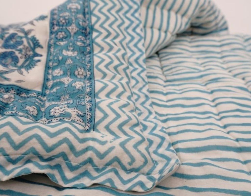 Detail of artisan block print on organic cotton quilt | Myyra Jaipur