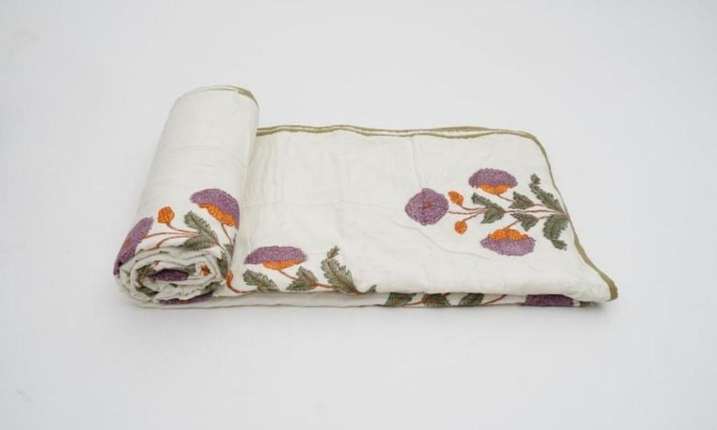 Dohar (lightweight cotton quilt) folded showing pattern repeat of hand block print | Myyra Jaipur