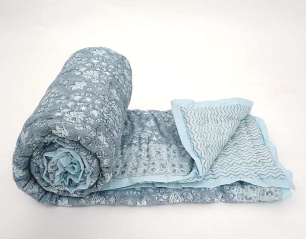 Styled view of hand block printed organic cotton quilt | Myyra Jaipur