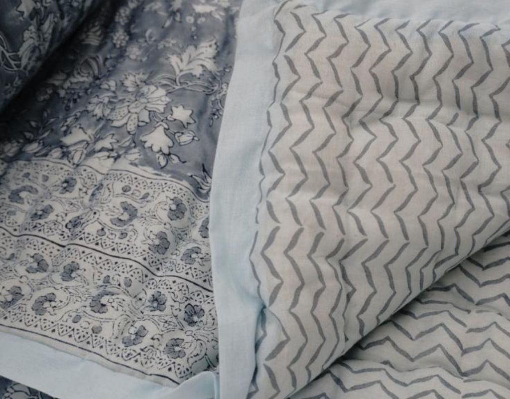Detail of artisan block print on organic cotton quilt | Myyra Jaipur