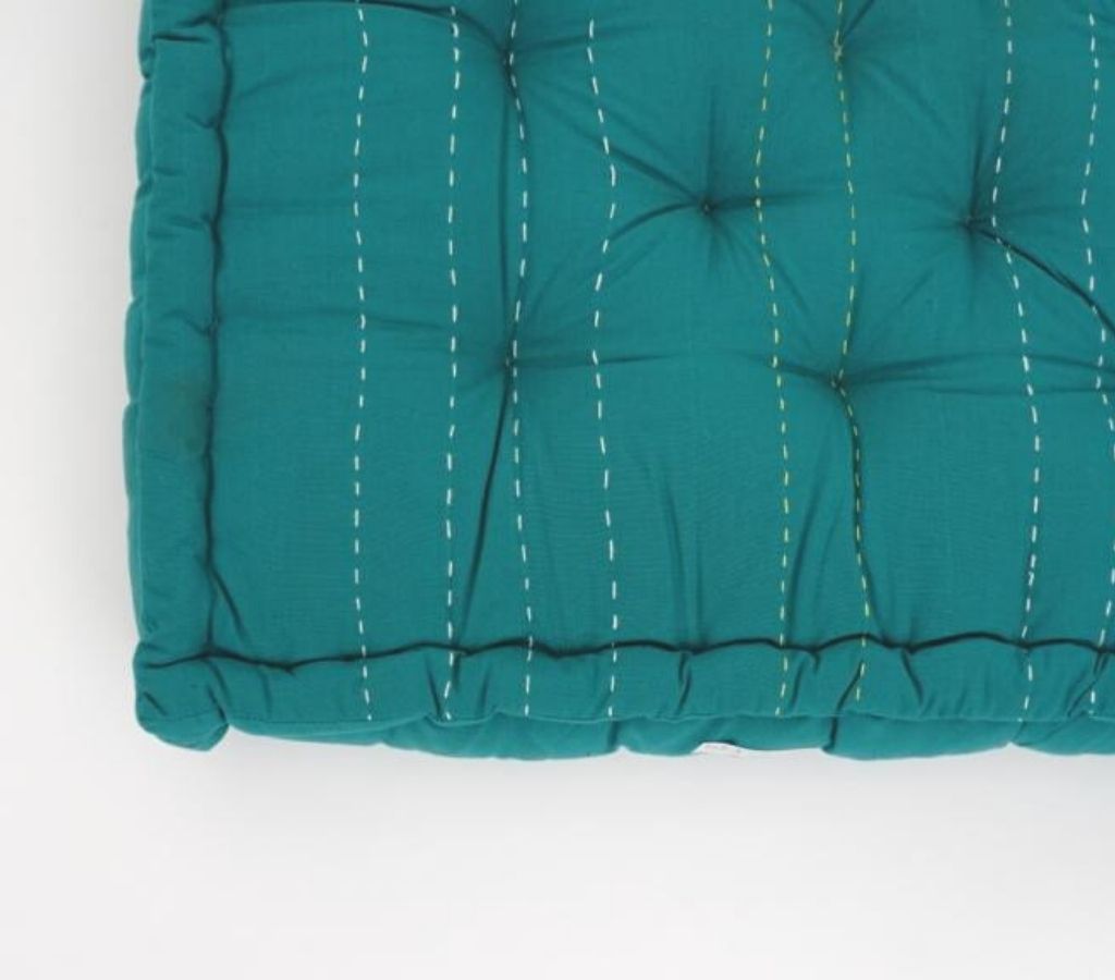 Floor cushion styled view from Myyra Jaipur