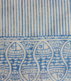Close-up of fish motif hand block print on organic cotton table runner | Myyra Jaipur