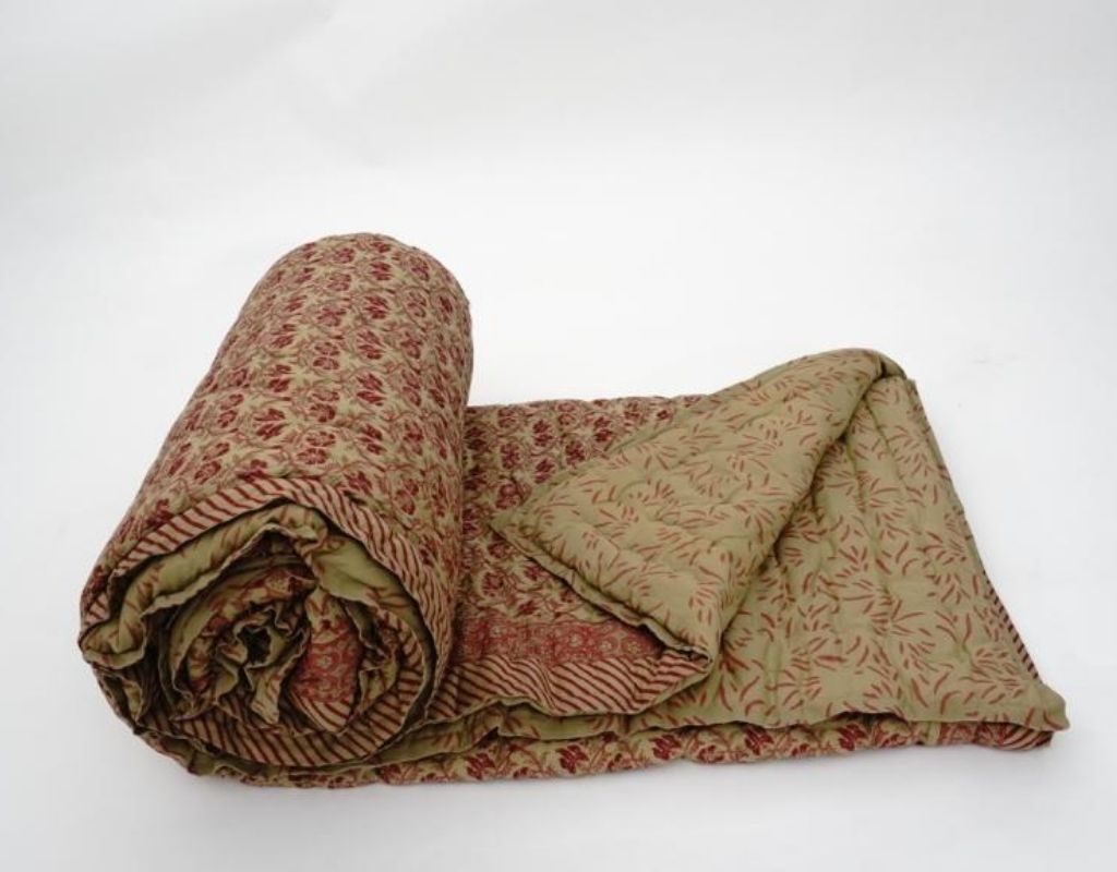 Styled view of hand block printed organic cotton quilt | Myyra Jaipur