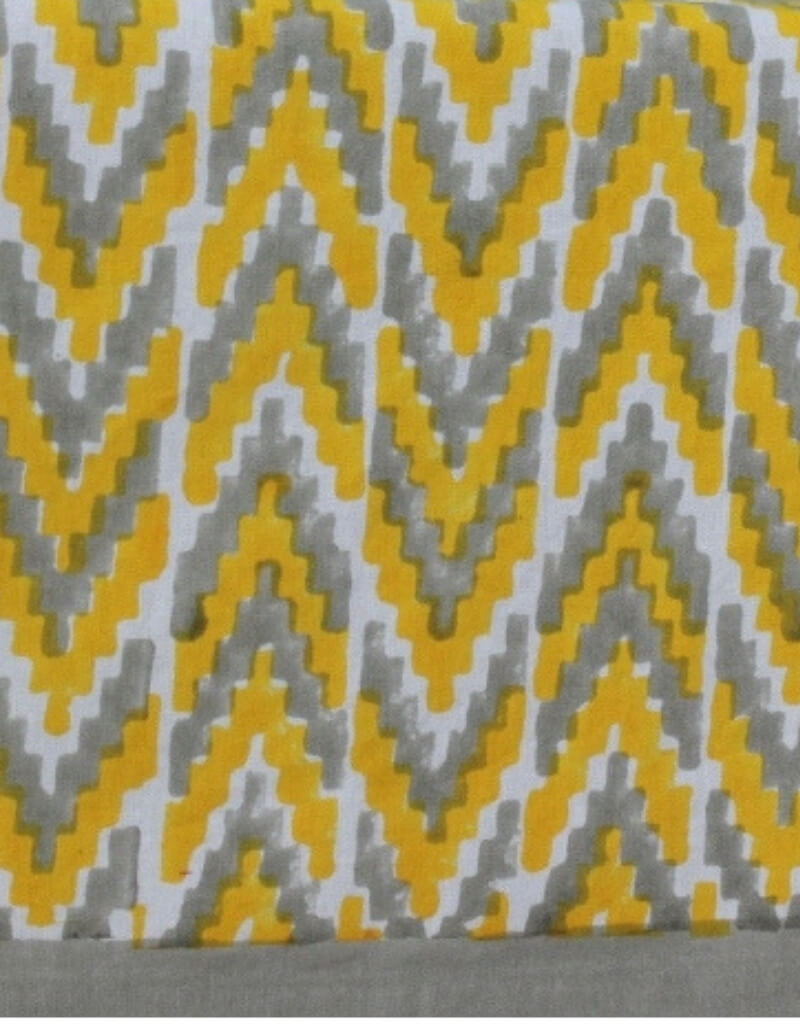 Close-up of ikat hand block print on organic cotton table cover | Myyra Jaipur