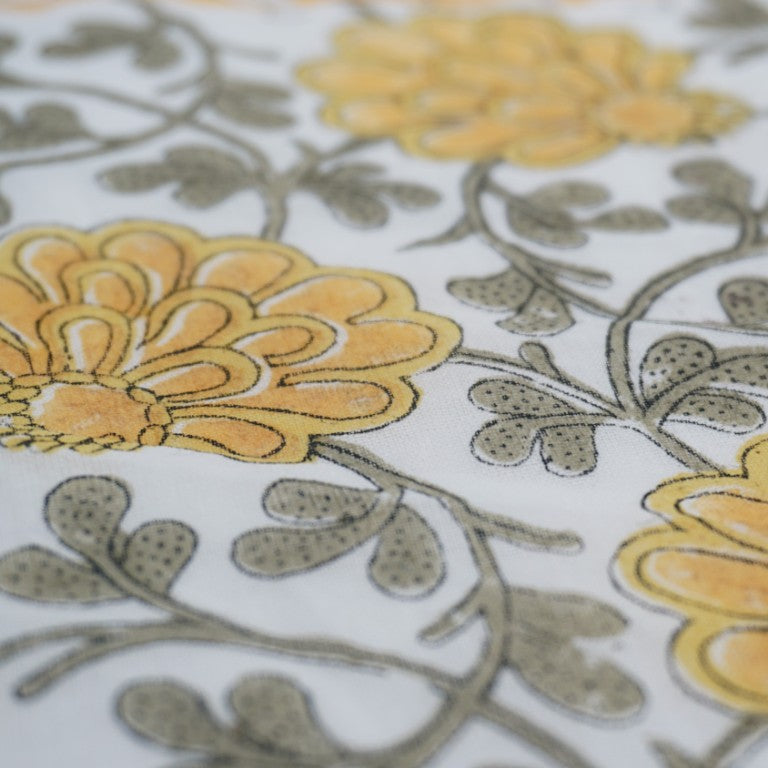 Close-up of hand block print on organic cotton running fabric | Myyra Jaipur