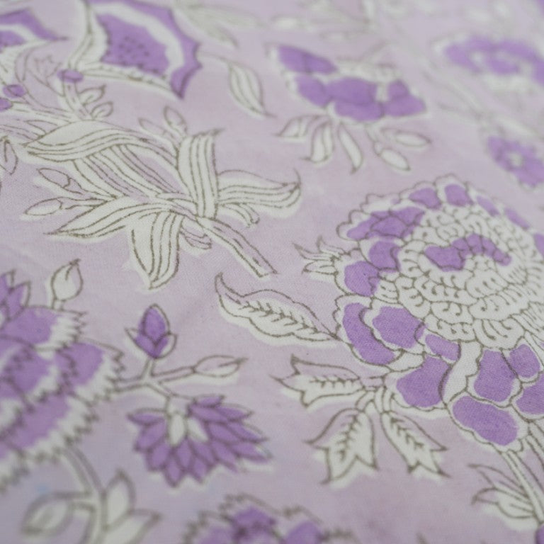 Close-up of hand block print on organic cotton running fabric | Myyra Jaipur
