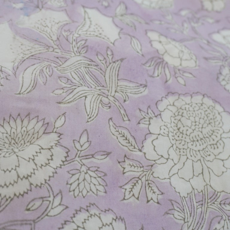Close-up of hand block print on organic cotton running fabric | Myyra Jaipur