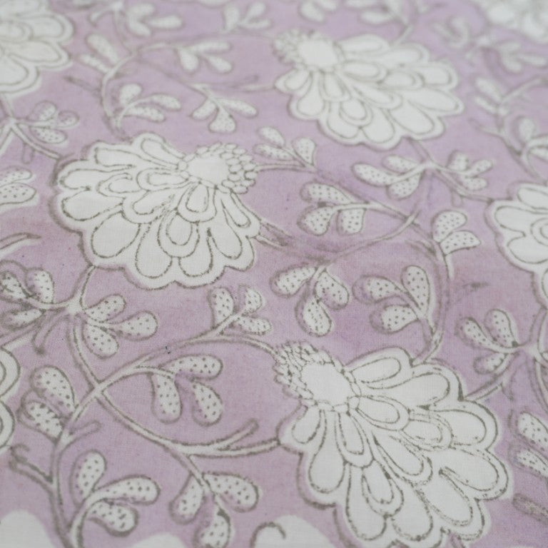 Close-up of hand block print on organic cotton running fabric | Myyra Jaipur