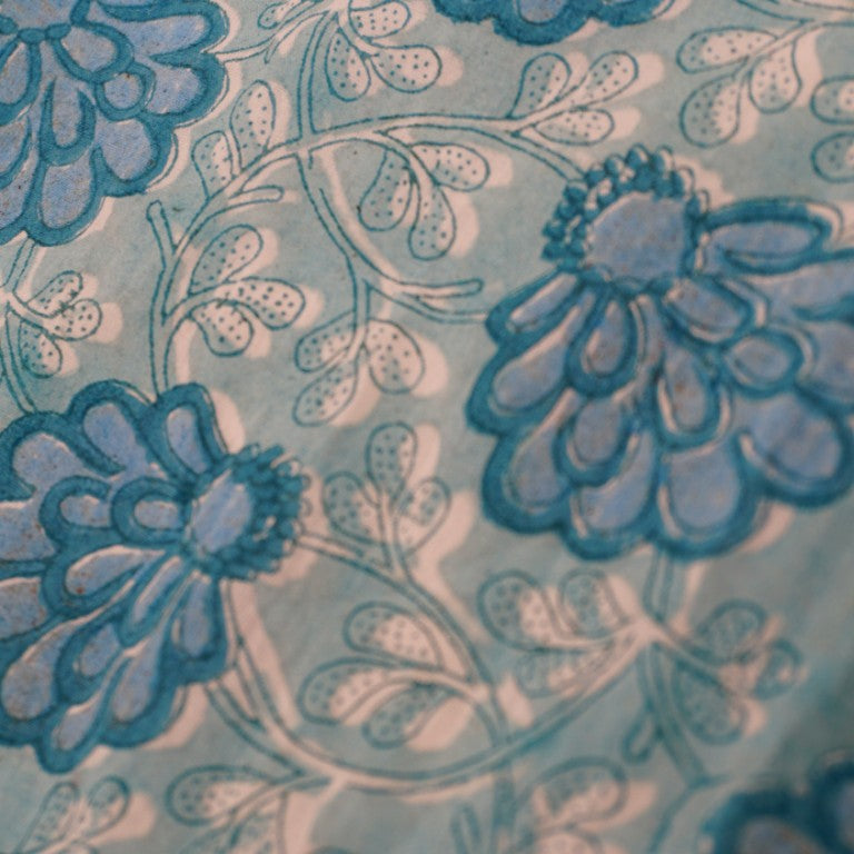 Close-up of hand block print on organic cotton running fabric | Myyra Jaipur