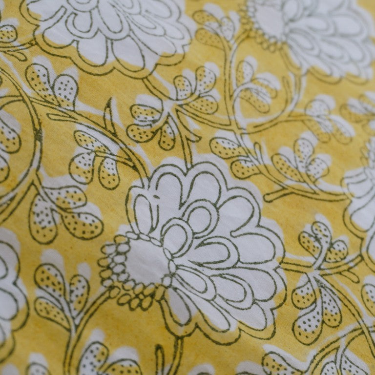 Close-up of hand block print on organic cotton running fabric | Myyra Jaipur
