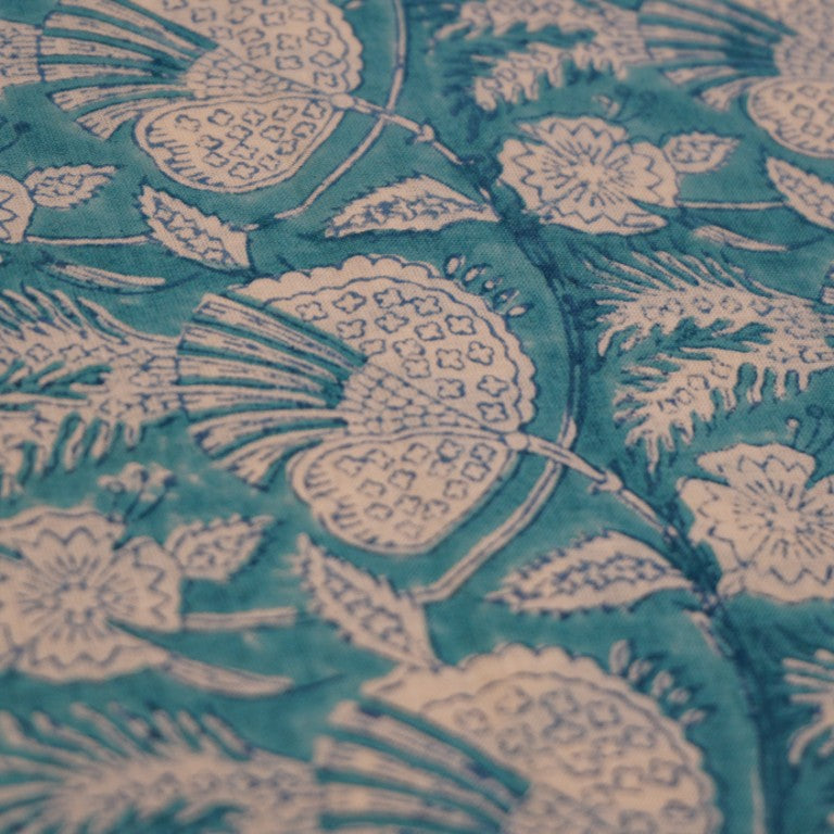 Folded hand block printed organic cotton yardage showing pattern repeat | Myyra Jaipur
