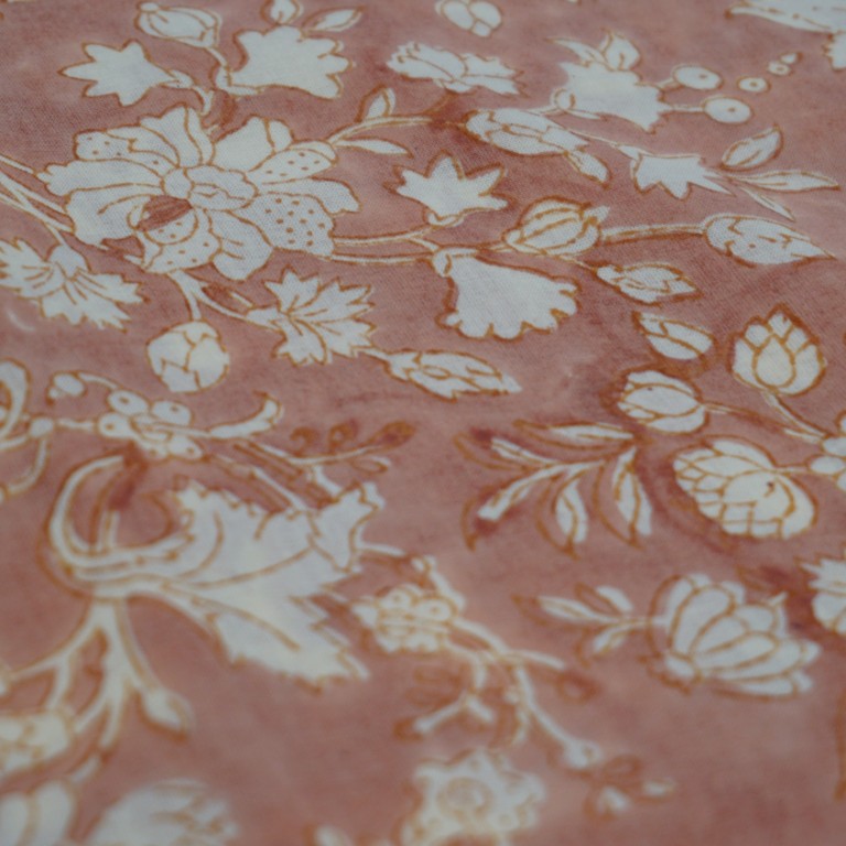 Folded hand block printed organic cotton yardage showing pattern repeat | Myyra Jaipur