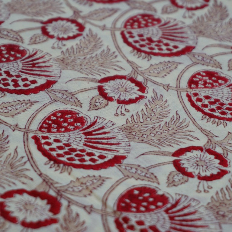 Folded hand block printed organic cotton yardage showing pattern repeat | Myyra Jaipur