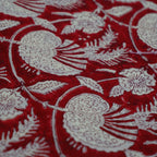 Folded hand block printed organic cotton yardage showing pattern repeat | Myyra Jaipur