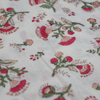 Folded hand block printed organic cotton yardage showing pattern repeat | Myyra Jaipur