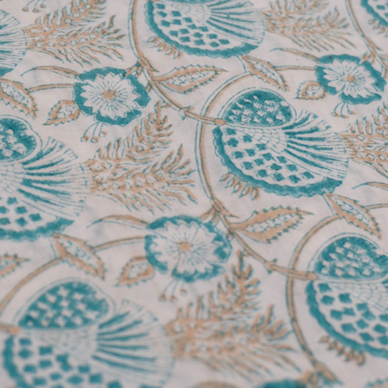 Folded hand block printed organic cotton yardage showing pattern repeat | Myyra Jaipur