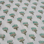 Folded hand block printed organic cotton yardage showing pattern repeat | Myyra Jaipur