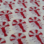 Folded hand block printed organic cotton yardage showing pattern repeat | Myyra Jaipur