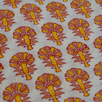 Folded hand block printed organic cotton yardage showing pattern repeat | Myyra Jaipur