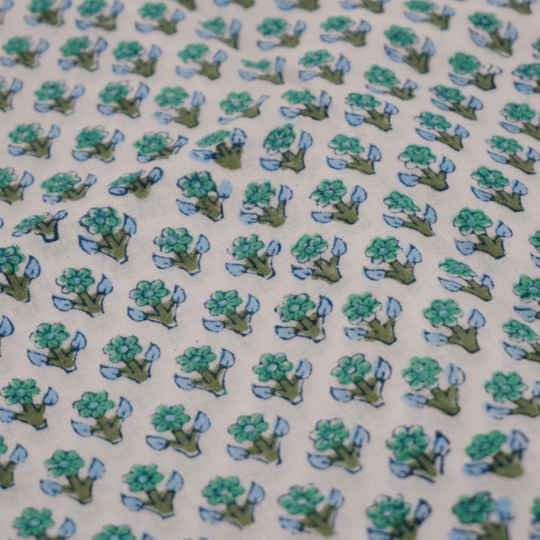 Close-up of hand block print on organic cotton running fabric | Myyra Jaipur