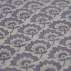 Folded hand block printed organic cotton yardage showing pattern repeat | Myyra Jaipur