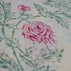 Folded hand block printed organic cotton yardage showing pattern repeat | Myyra Jaipur