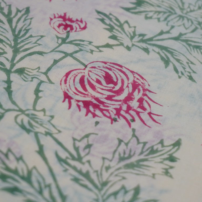 Folded hand block printed organic cotton yardage showing pattern repeat | Myyra Jaipur