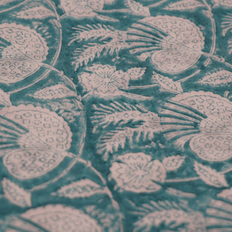 Folded hand block printed organic cotton yardage showing pattern repeat | Myyra Jaipur