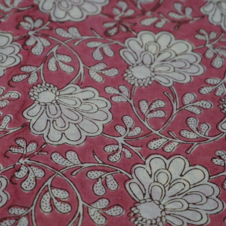 Folded hand block printed organic cotton yardage showing pattern repeat | Myyra Jaipur