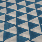 Folded hand block printed organic cotton yardage showing pattern repeat | Myyra Jaipur