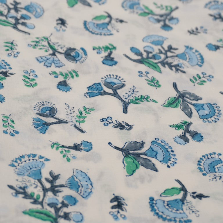 Folded hand block printed organic cotton yardage showing pattern repeat | Myyra Jaipur