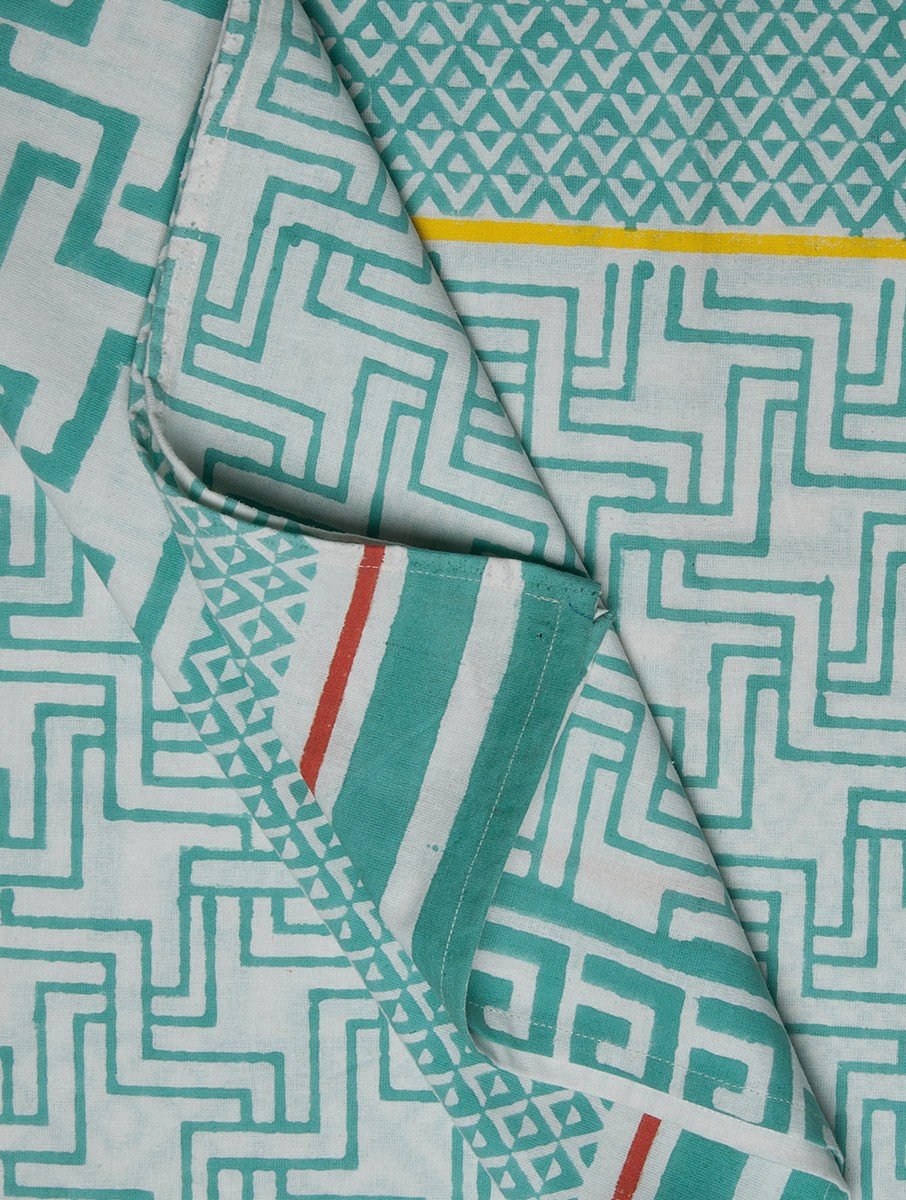 Close-up of white and green hand block print on organic cotton bed sheet | Myyra Jaipur