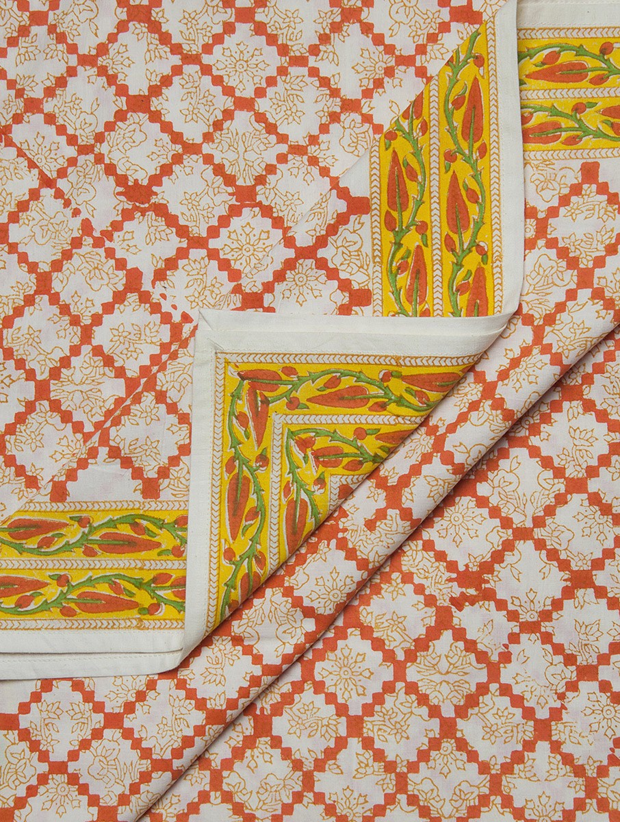 Close-up of cyan, white and orange hand block print on organic cotton bed cover | Myyra Jaipur