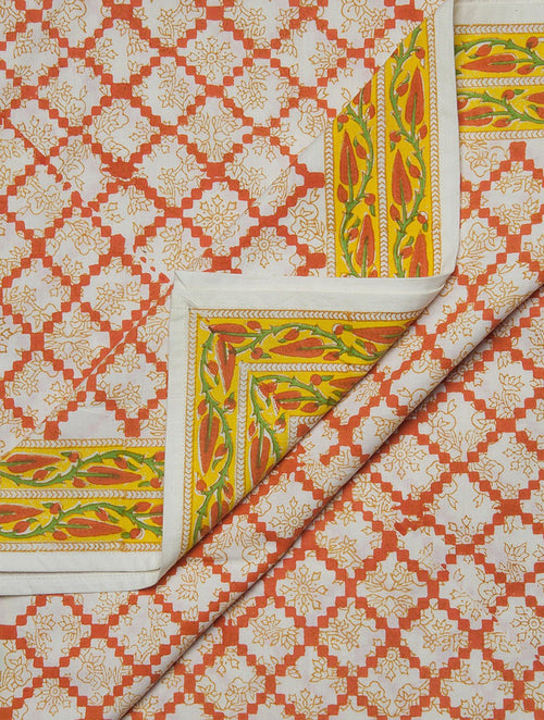 Close-up of cyan, white and orange hand block print on organic cotton bed cover | Myyra Jaipur
