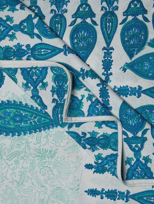 Close-up of blue, green and white hand block print on organic cotton bed cover | Myyra Jaipur