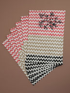 Close-up of black, beige and red hand block print on organic cotton placemat | Myyra Jaipur