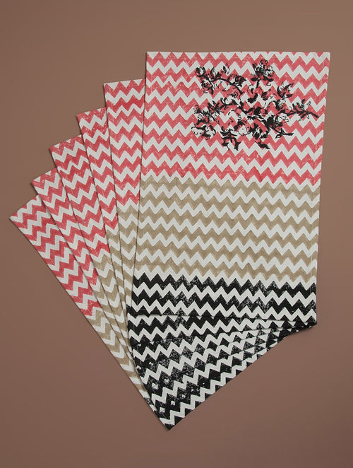 Close-up of black, beige and red hand block print on organic cotton placemat | Myyra Jaipur