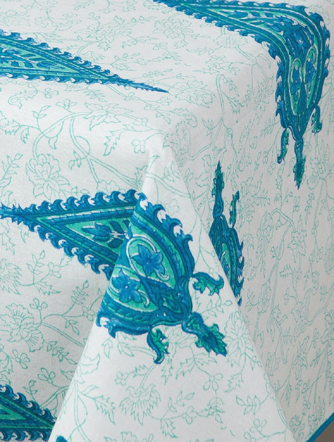 Close-up of blue and green paisley hand block print on organic cotton table cover | Myyra Jaipur