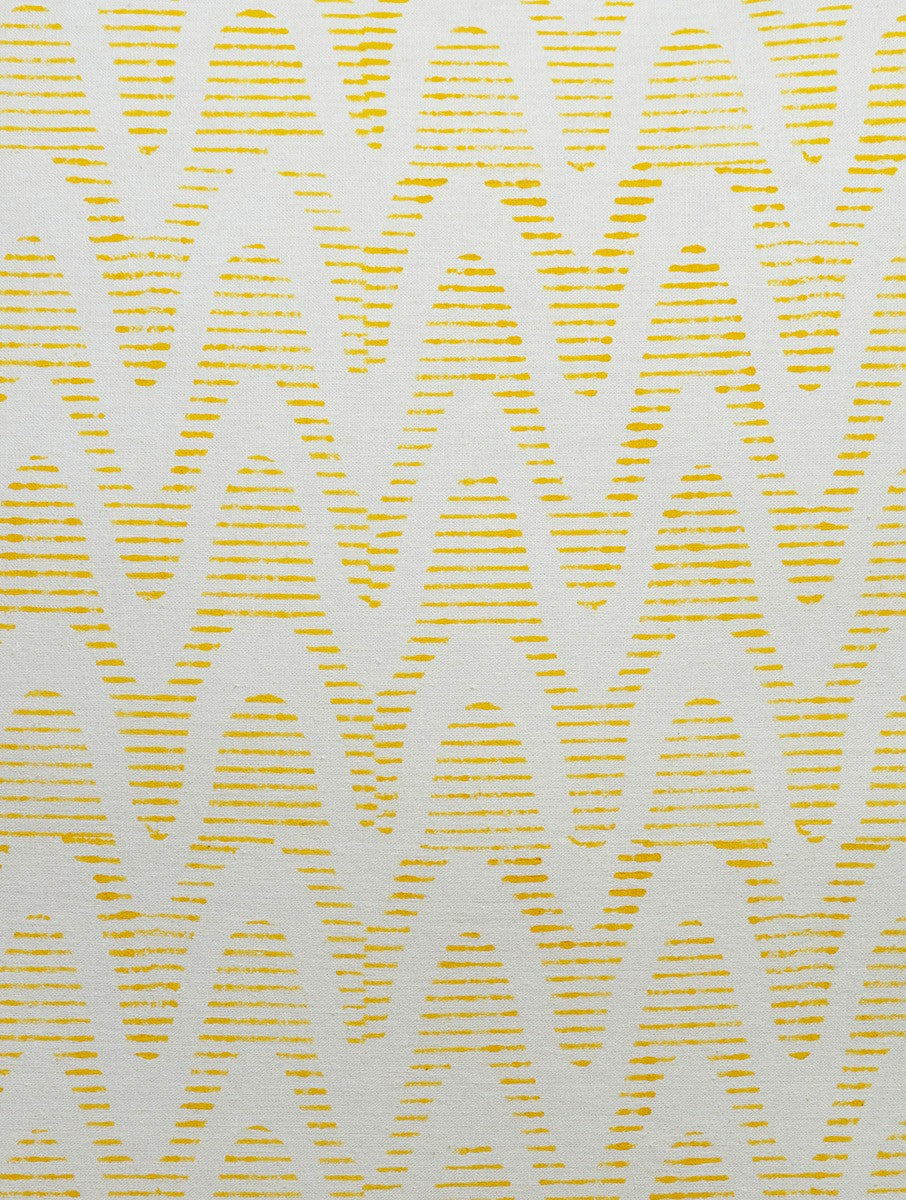 Close-up of yellow and white hand block print on organic cotton cushion cover | Myyra Jaipur