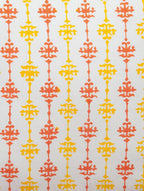 Close-up of red, yellow and white hand block print on organic cotton cushion cover | Myyra Jaipur