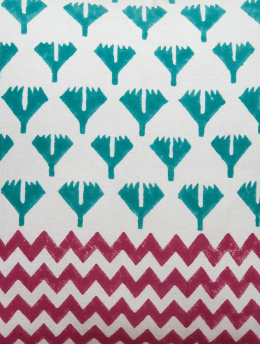 Close-up of red, green and white hand block print on organic cotton cushion cover | Myyra Jaipur