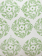 Close-up of green and white hand block print on organic cotton cushion cover | Myyra Jaipur