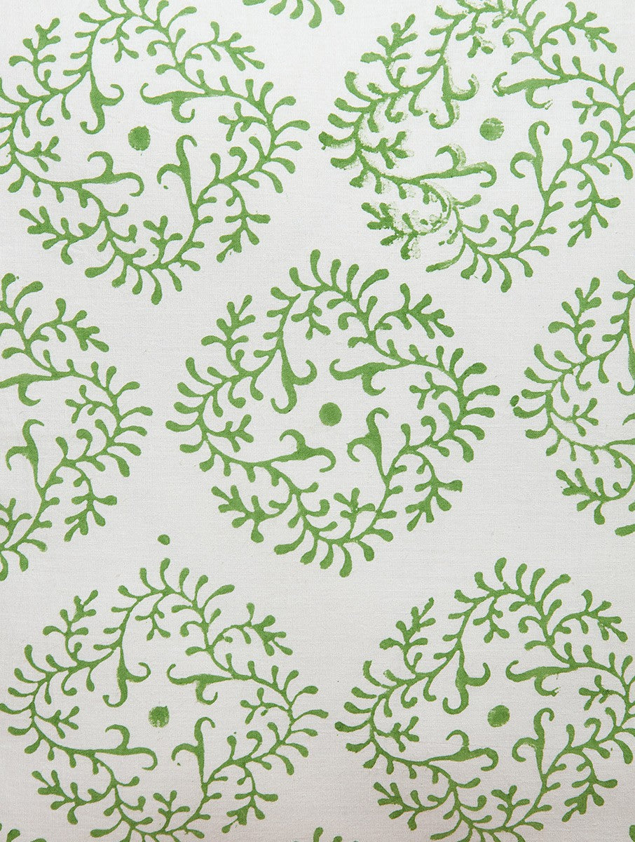 Close-up of green and white hand block print on organic cotton cushion cover | Myyra Jaipur