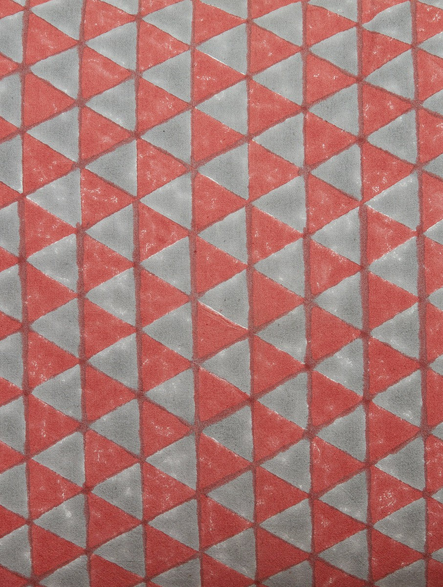 Close-up of red and grey hand block print on organic cotton pillow cover | Myyra Jaipur