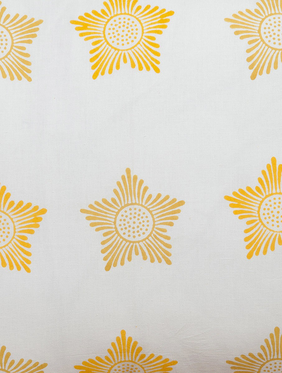 Close-up of yellow, white and orange hand block print on organic cotton pillow cover | Myyra Jaipur