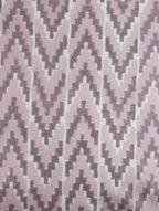 Close-up of ikat hand block print on organic cotton cushion cover | Myyra Jaipur