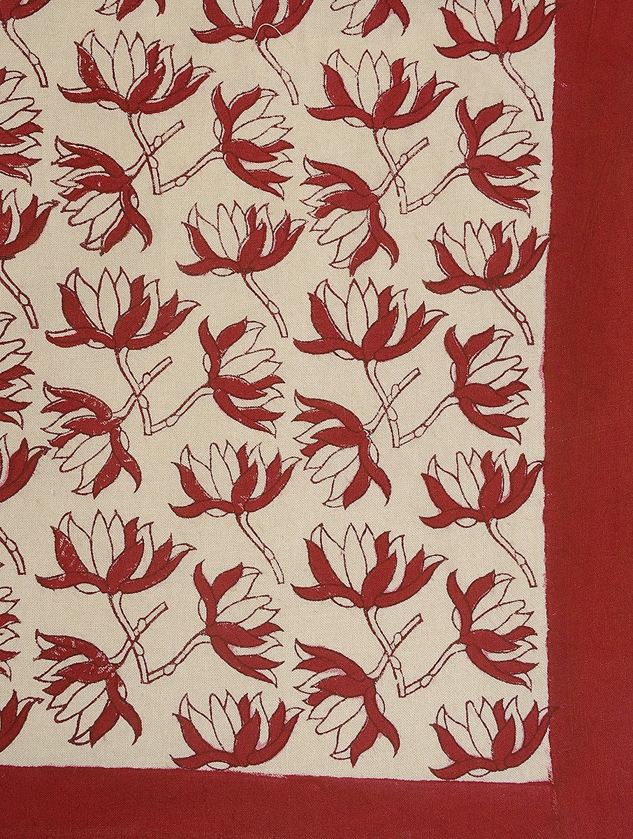 Close-up of red flower hand block print on organic cotton bed cover | Myyra Jaipur