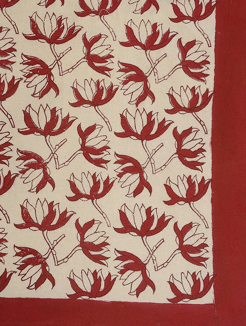 Close-up of red flower hand block print on organic cotton bed cover | Myyra Jaipur